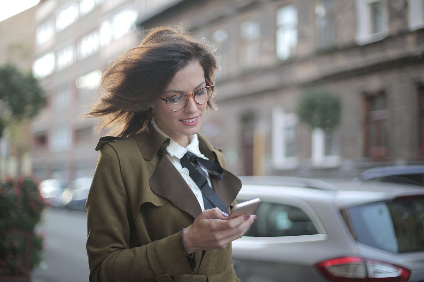 amazon marketing consultant a woman with smartphone walking through the street