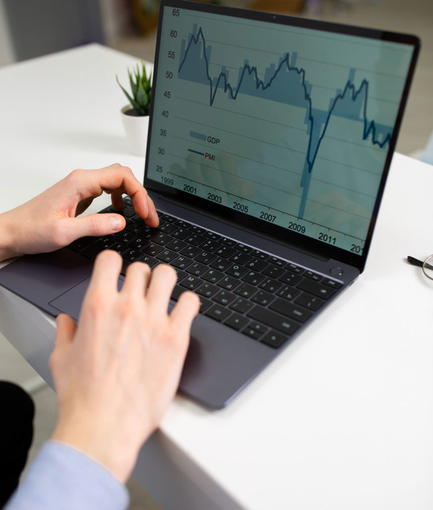 digital marketing for financial services man's hands typing on the laptop with display showing diagram