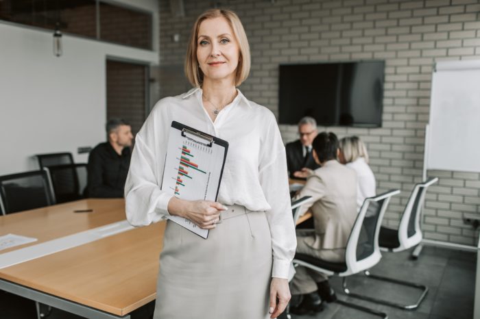 marketing automation specialist woman with plot board at the conference