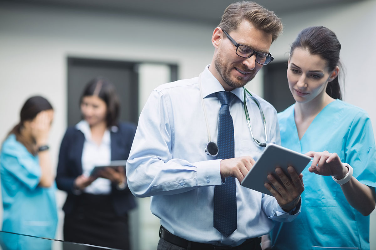 digital marketing for hospital 2022 doctor nurse discussing digital tablet