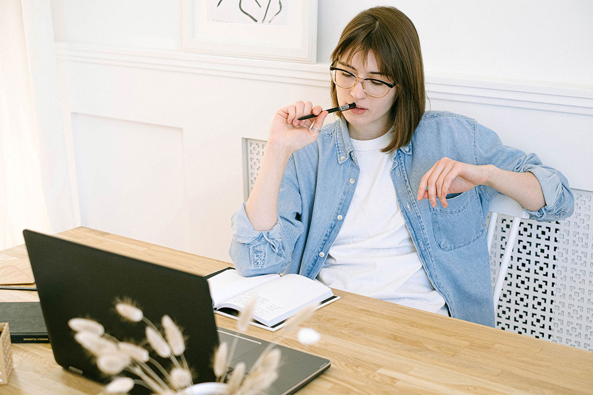 healthcare online marketing girl copywriter with laptop