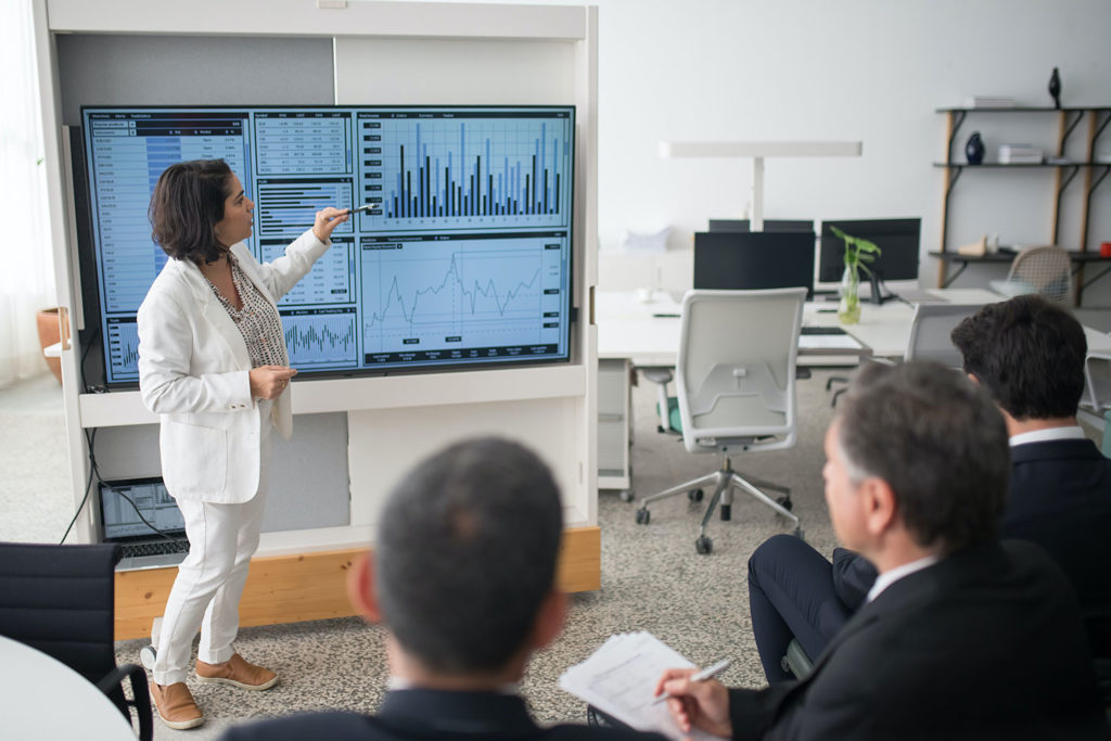 woman presents diagram of email opens and clicks