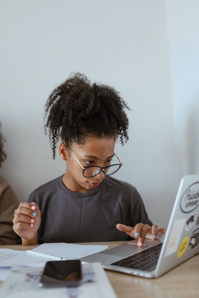 afro american woman making seo analysis and noting down results