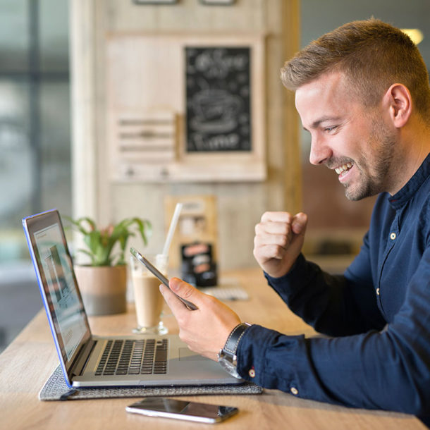 happy freelancer with tablet laptop computer