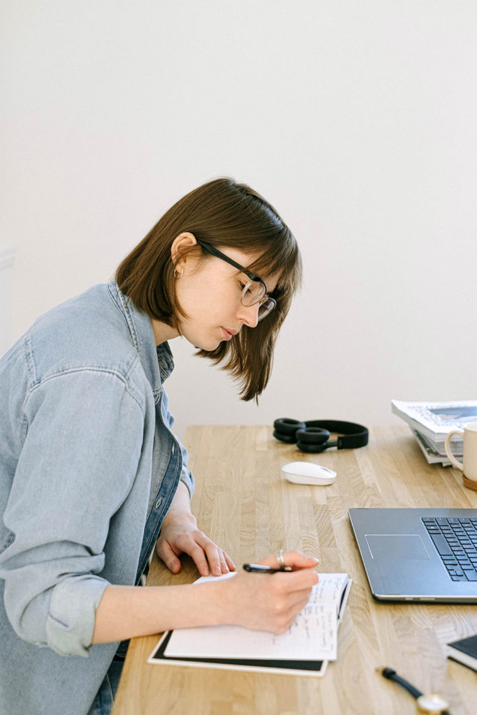 qualified writer making notes concerning future content