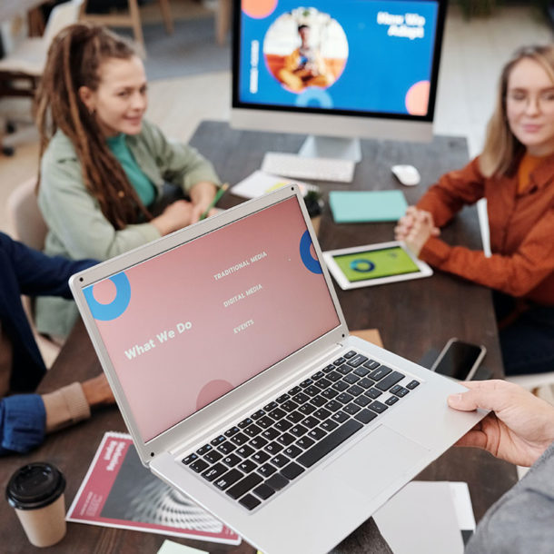 seo experts discussing a website displayd on the laptop in the office