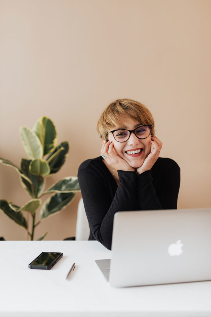 seo experts female with laptop and smartphone in the office